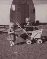 Children outside a Nissen hut at Broadmeadows migrant hostel.