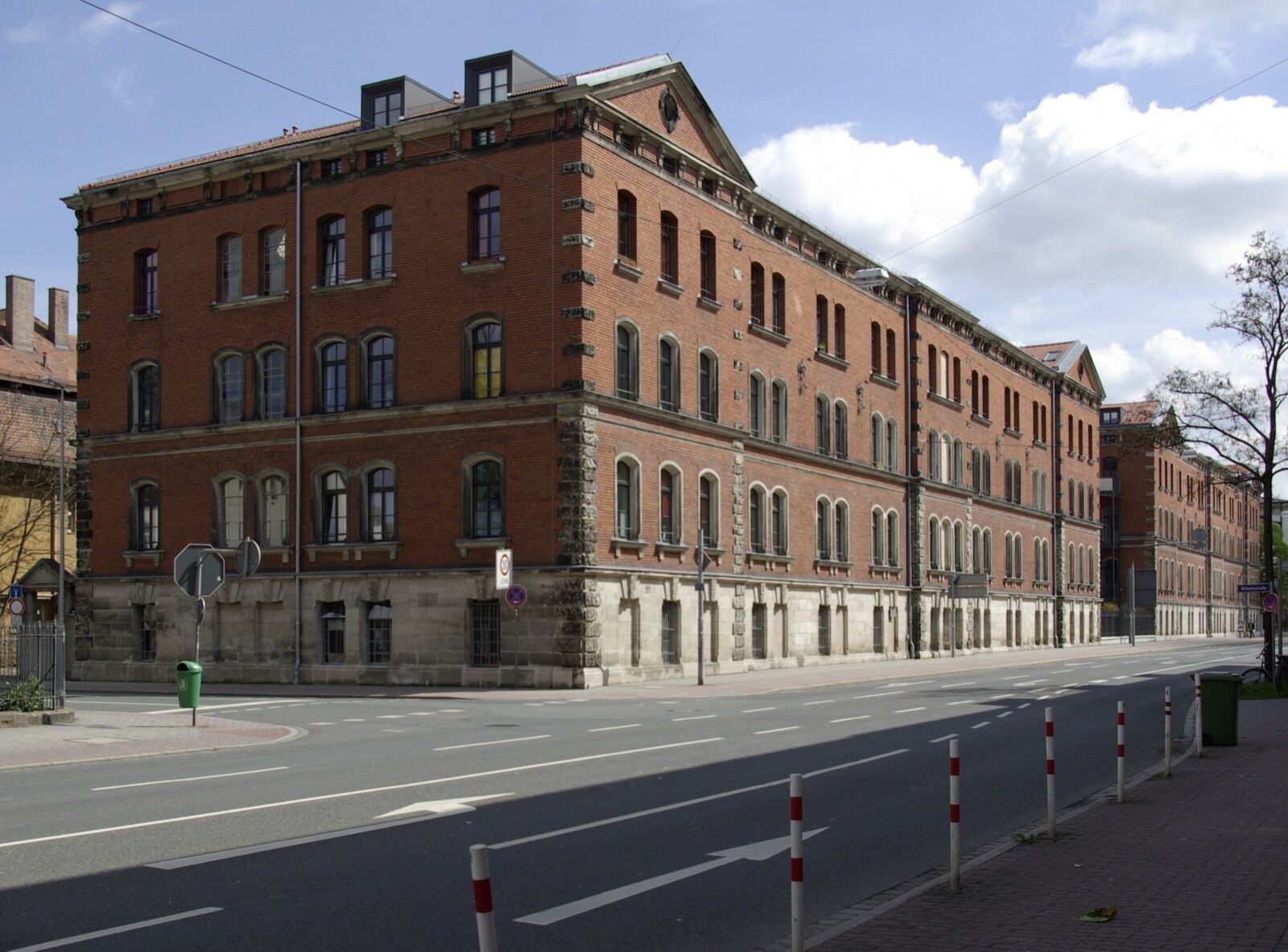 Two long rendered barrack blocks with regular windows and steep roofs in Drausnickstraße, Erlangen.