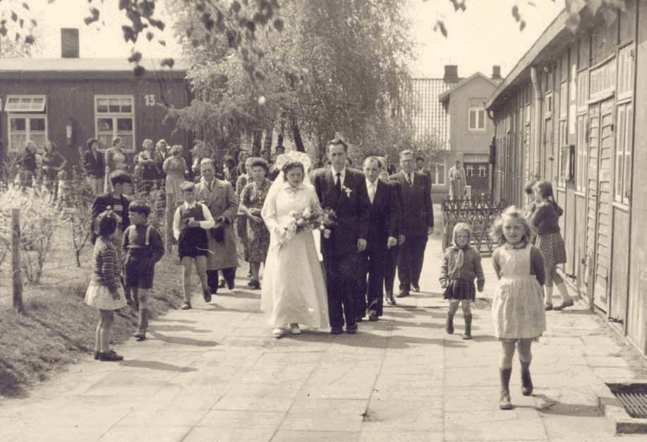 Wedding procession between the camp buildings at Falkenberg.