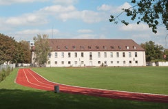 A surviving Funkkaserne building and its sports ground.