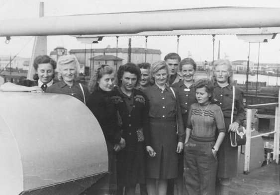 A group of young passengers on the deck of the General Stuart Heintzelman before departure in October 1947.