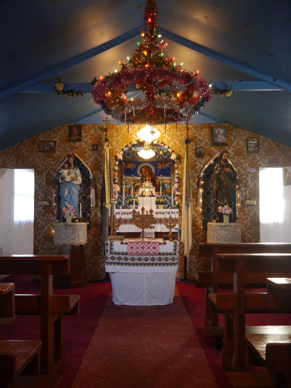 The interior of the Hallmuir chapel, looking towards the altar screen.