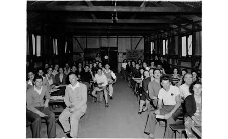 An English class for adult migrants in an Army hut at Northam, 1950.