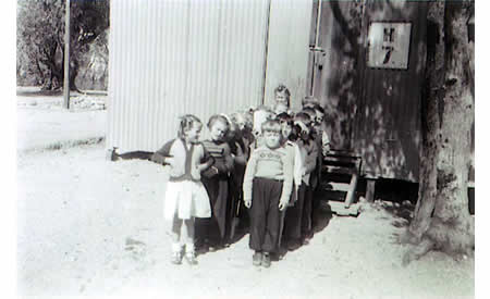 School children waiting outside Hut 7 at Northam, about 1950.