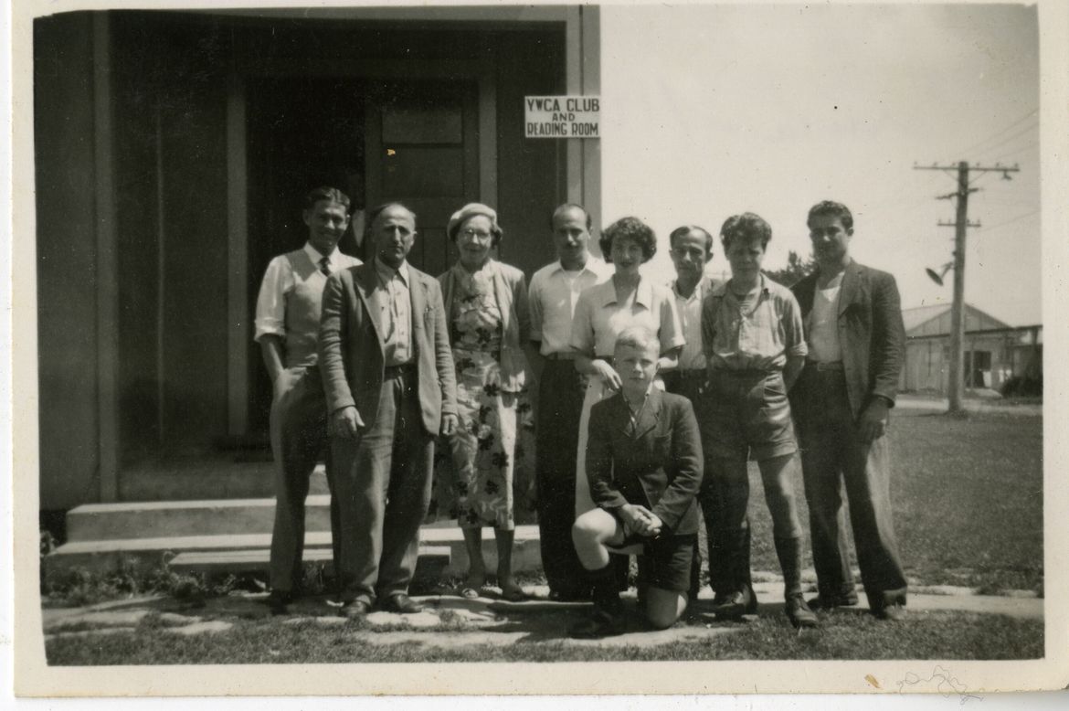 People gathered outside one of the camp buildings, 1951–1952.