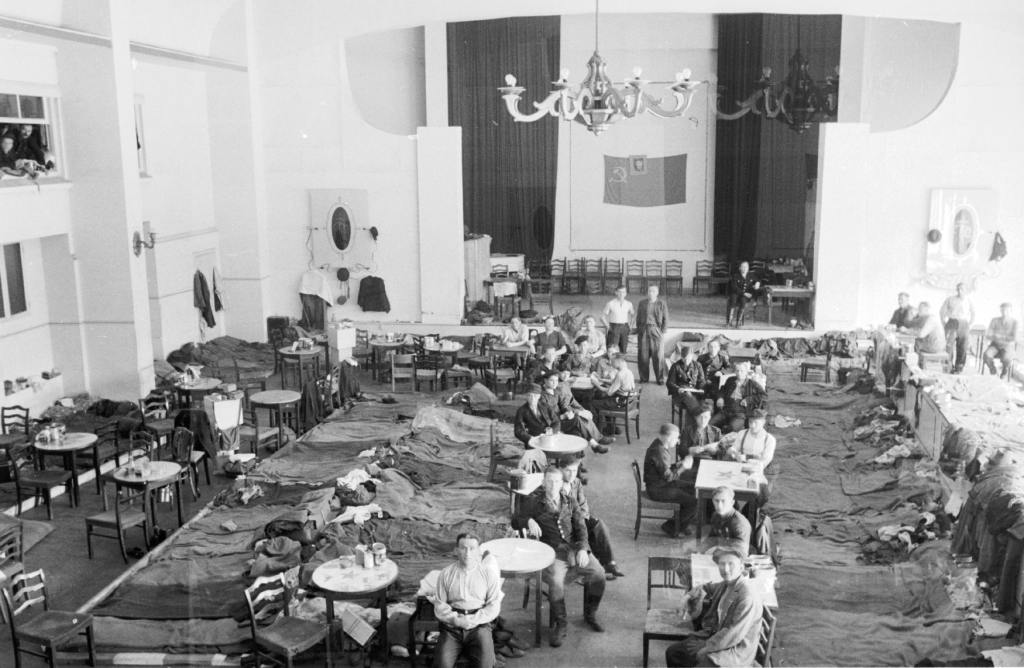 Beds, chairs and tables inside the former theatre