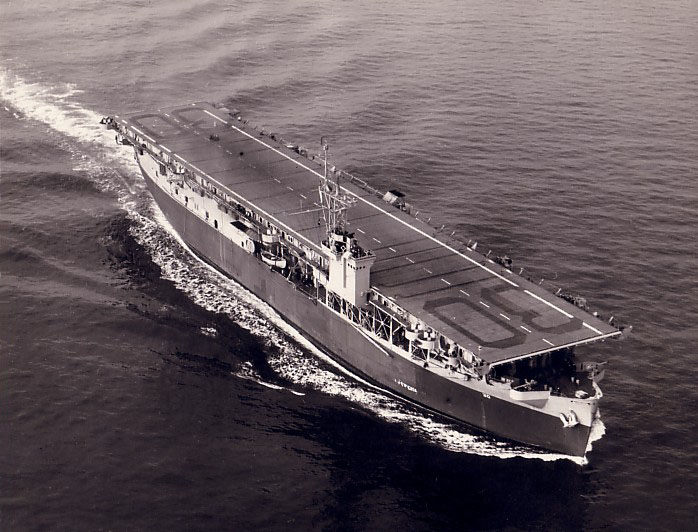 The escort carrier USS Charger under way at sea in 1943, painted in camouflage measure 22.
