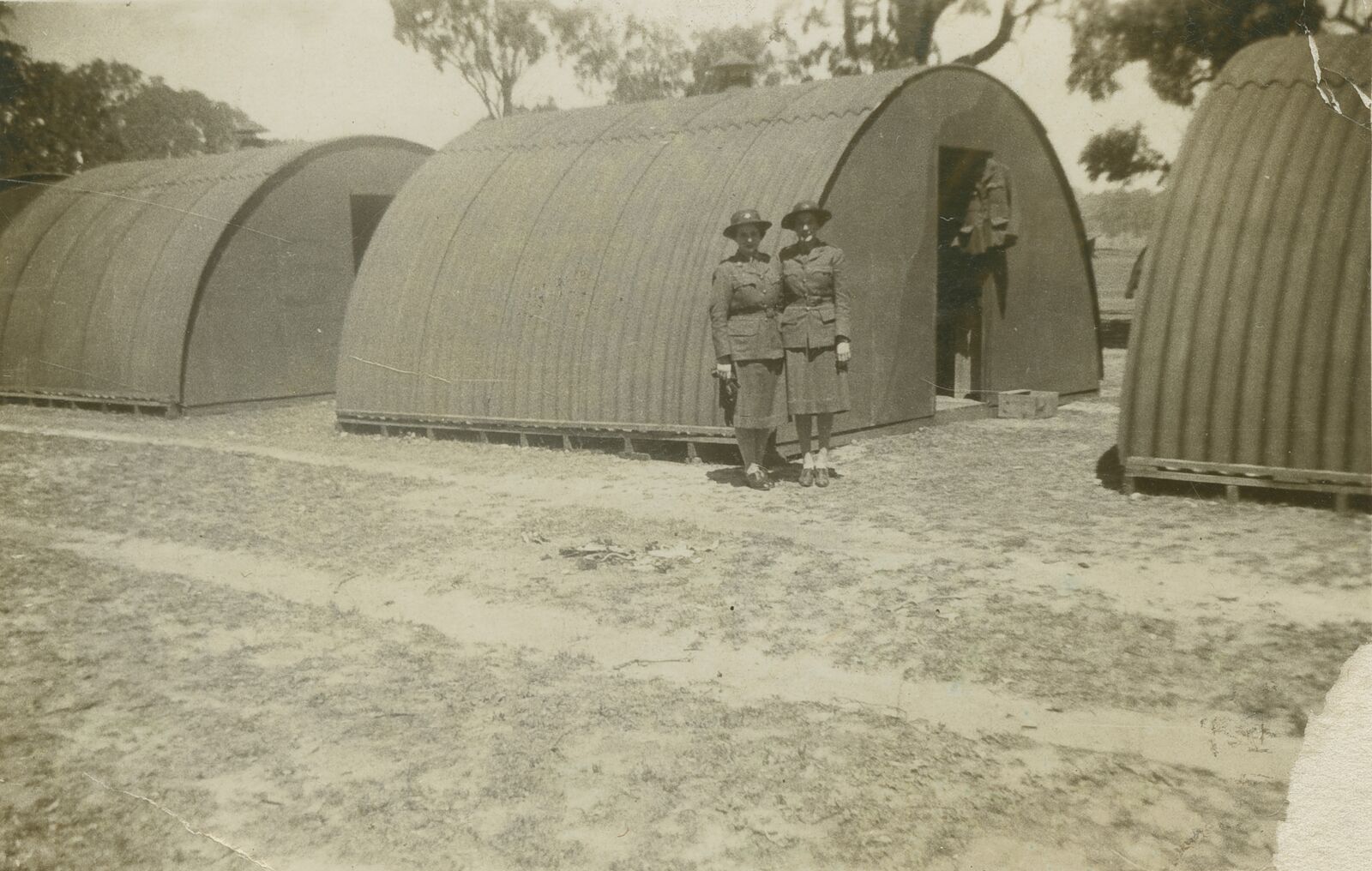 Nissen huts at the 3rd Advanced Ordnance Depot, Wallangarra, photographed in 1942 with Australian Women’s Army Service members.