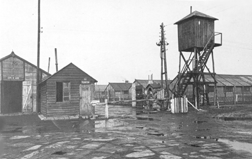 Wooden camp barracks and elevated water tank at Waterschei.