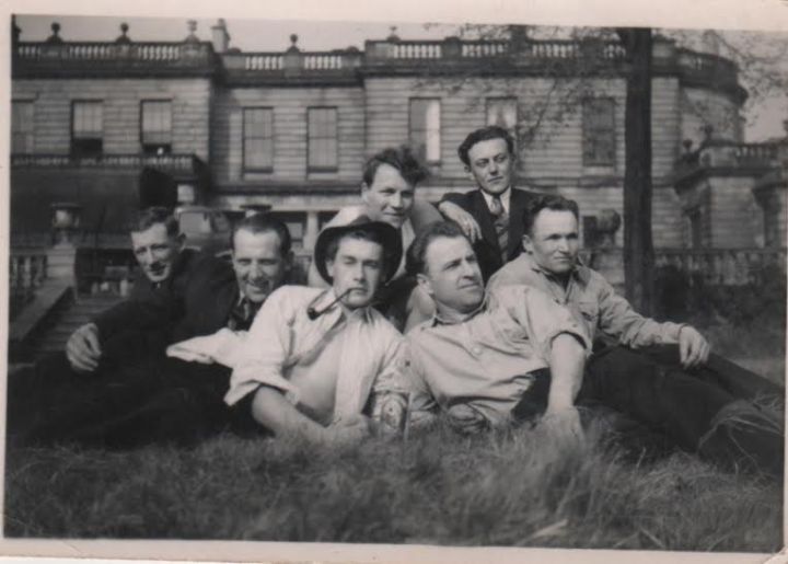 European Voluntary Worker farm workers relaxing outside Windlestone Hall.